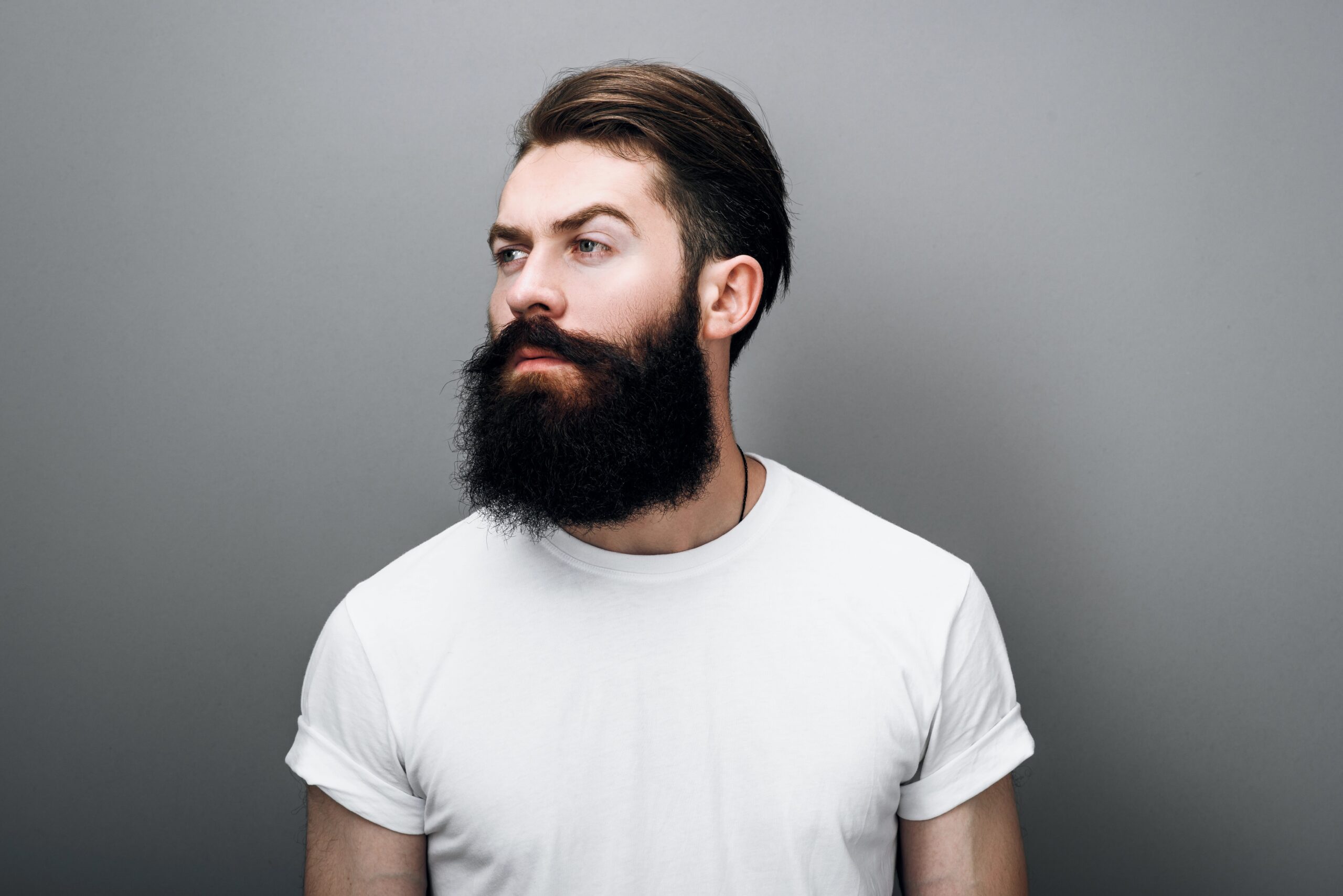 Portrait of young man with thick beard