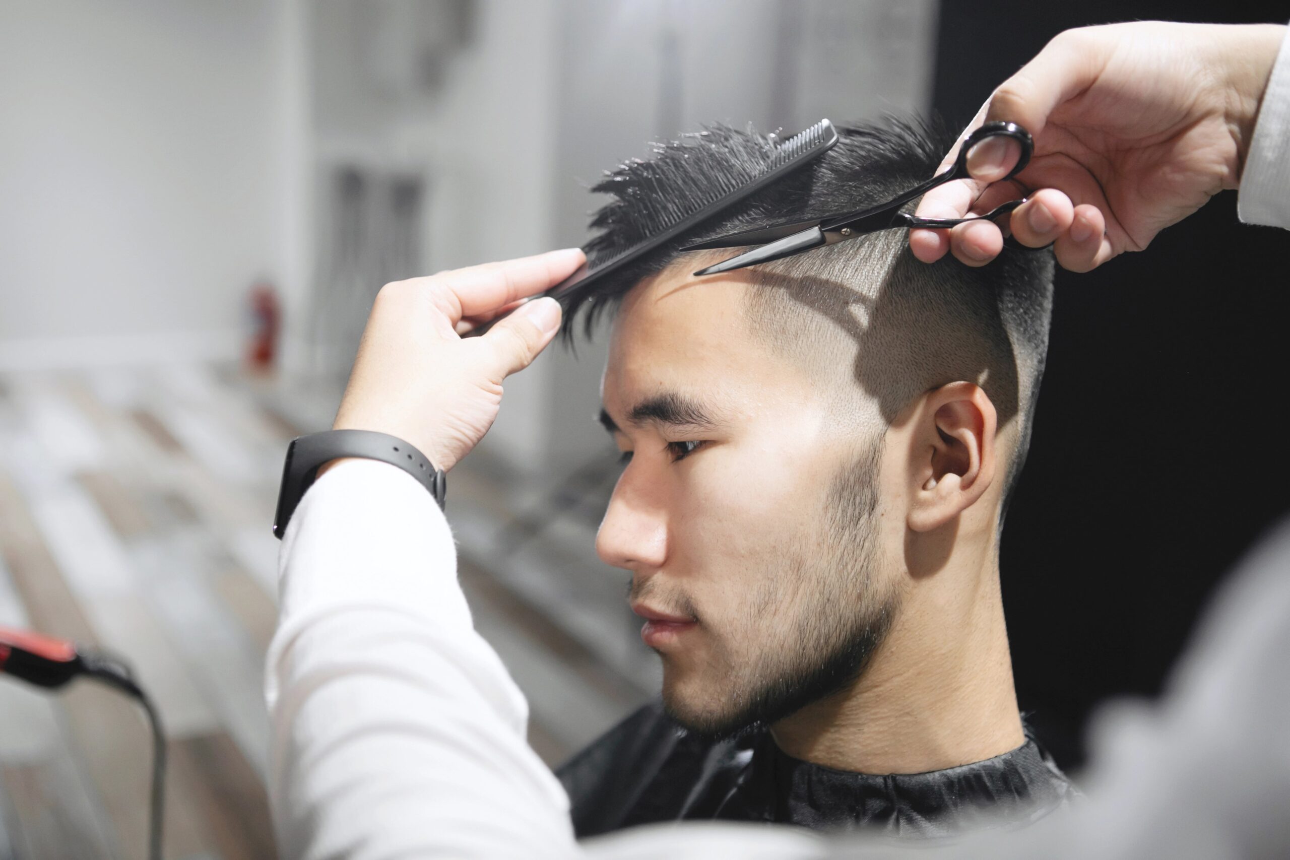 Young man receiving haircut
