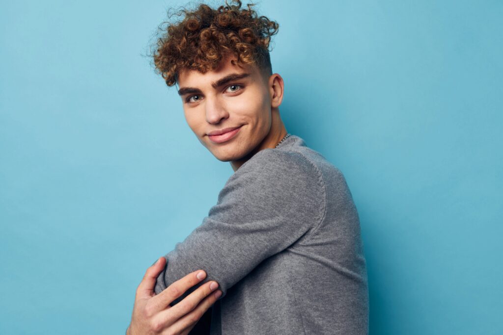 Attractive young man with curly hair