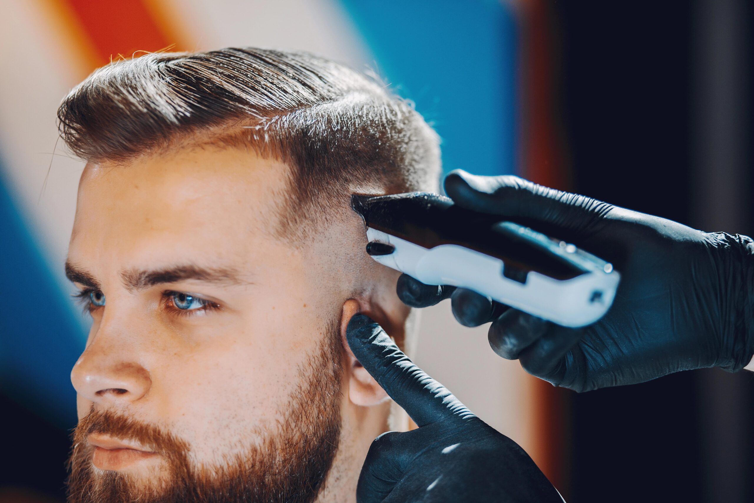 Stylish young man getting a haircut